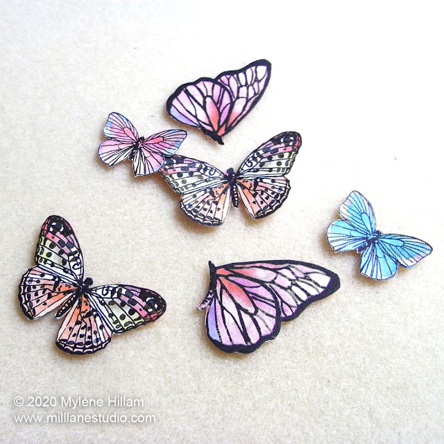 Cut out butterflies ready for coating with resin