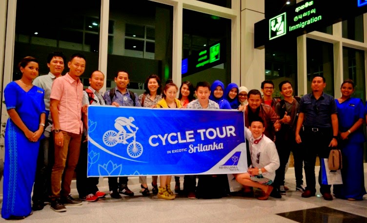 Group of Indonesian tourists on a cycle tour, disembarking at MRIA