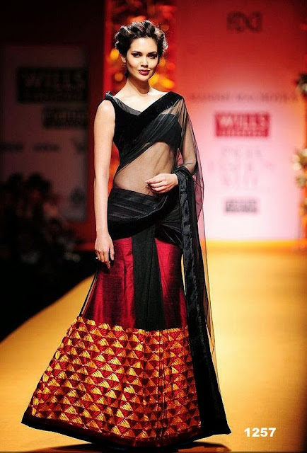Bollywood Actress Esha Gupta in Simple Black with Red Net Lehenga Saree