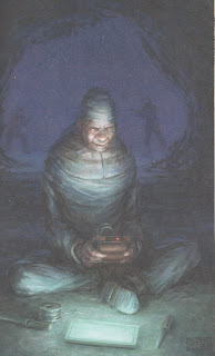 A white clad figure in a cave, etrance by a device as he's illuminated by a tablet looking device. Tools are around the sitting figure, who is happily oblivious to the two armed silhouettes approaching from behind.