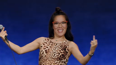 comedy special - Ali Wong: Hard Knock Wife - Ali Wong holds her her middle fingers