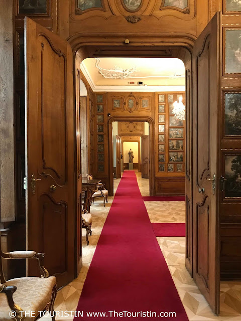 View through several open wooden doors in the Mirbach Palace in Bratislava in Slovakia