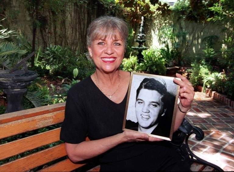 June Juanico showing a photo of Elvis
