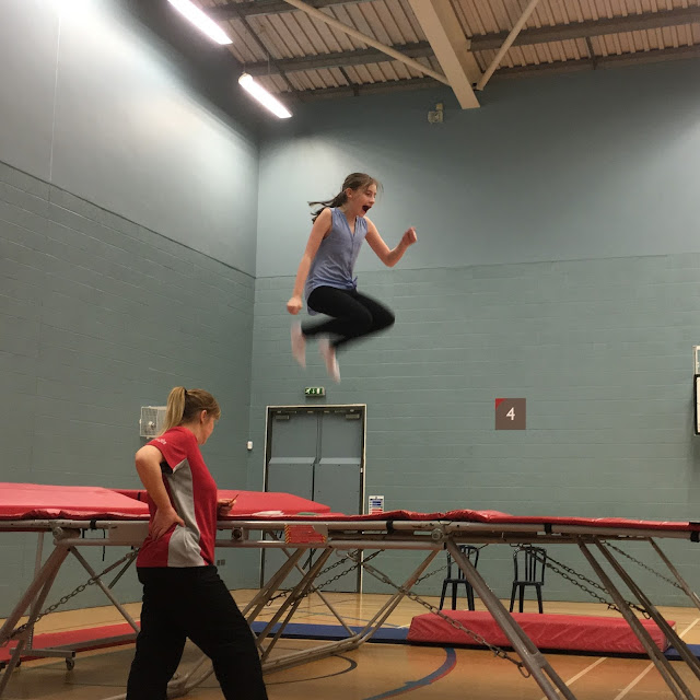 Sasha jumping high on trampoline