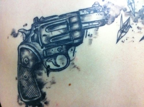 Close Up of Gun Again Tattoo