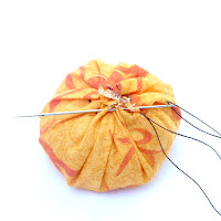 DIY spiced fabric pumpkins fall centerpieces - stitch the top of the pouch closed