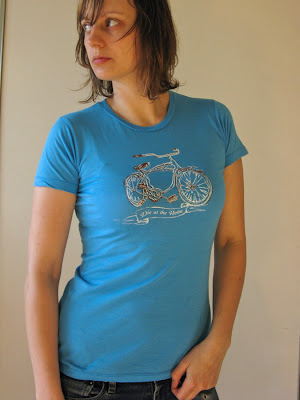 Portrait of a woman (Aramee Diethelm) in a shirt she designed and hand silkscreened