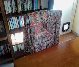 curtains hanging on the back of a chair