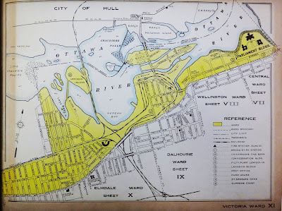 Map showing Victoria Ward (XI) in Ottawa highlighted in yellow, with drawn and named streets within the ward and some outside for context. Wellington Street extends diagonally from the bottom left (Hintonburg) to the upper right (Parliament Hill), breaking through the frame of the map. North of Scott Street and west of Parkdale is outside the City Limits, but Mechanicsville and Lemieux, Chaudiere, and Victoria Islands are painted in as part of the Ward. Rail lines snake through the ward from the bottom, left, and top of the page converging in the Bayview area and extending to LeBreton Flats in the middle of the map. From west to east, adjacent wards are noted: Elmdale (X), Dalhousie (IX), Wellington (VIII), and Central (VII).