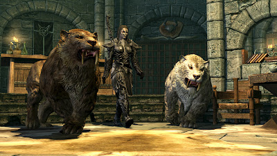 female dragonborn with 2 summoned sabertooth tigers