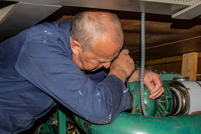 Photo of Phil removing the exhaust elbow from the starboard engine