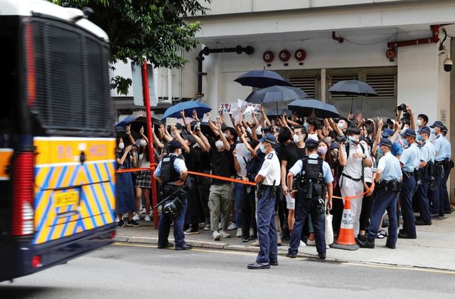 Police have arrested around 50 Hong Kong supporters of democracy under the new National Security Act