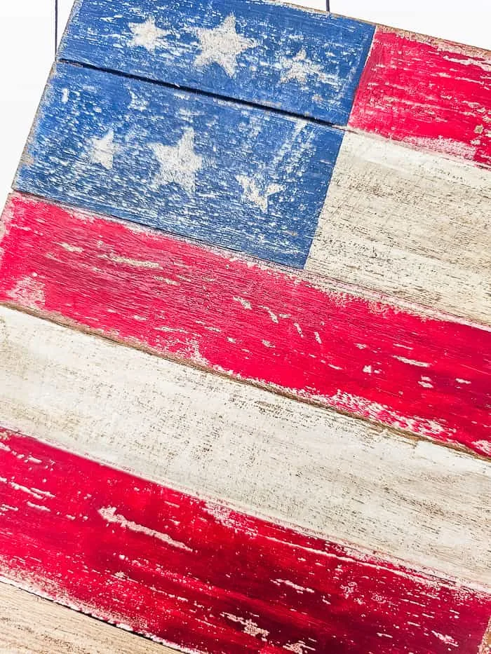 weathered, worn wood painted flag close up