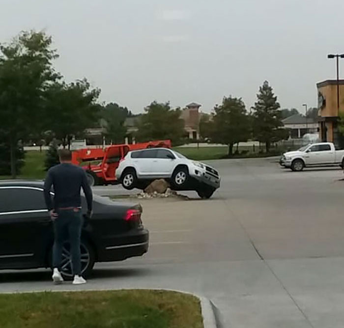 Someone Placed A Giant Stone To Prevent Drivers From Cutting The Corner, And The Results Were Hilarious