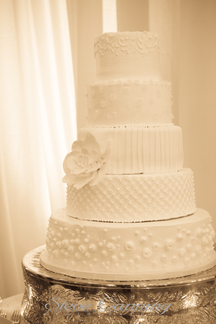 Silver cake stand is part of the inventory at Elizabeth Bailey Weddings 