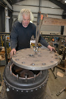 The steam dome lid was gently placed on the copper gasket and bolted down.