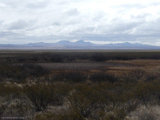 08: flat dirt spot below distant hills