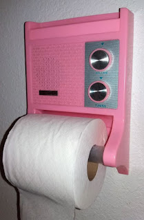 Pink AM transistor radio with toilet paper holder