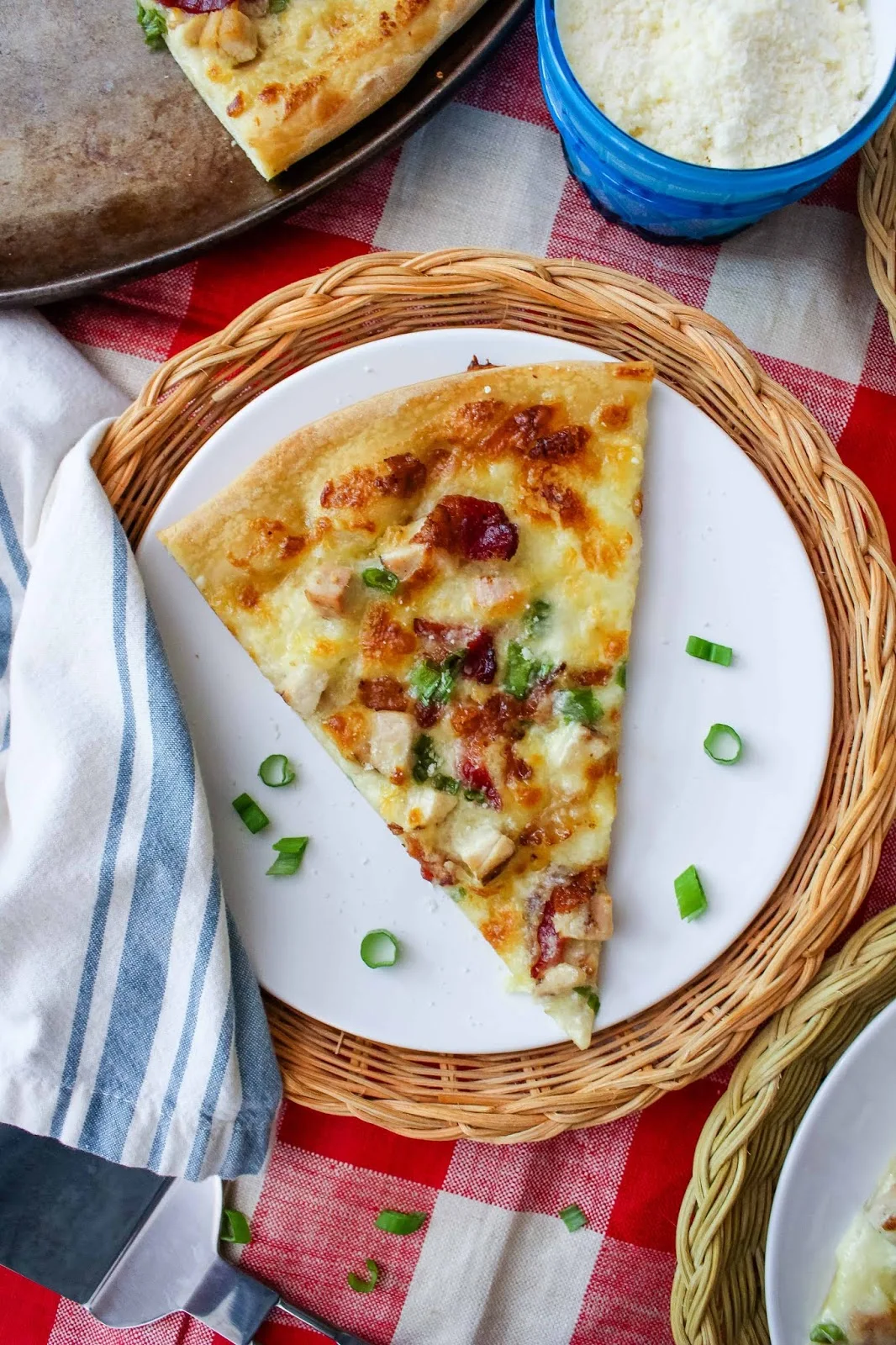 Chicken Alfredo Pizza will rock your pizza night! Topped with cubed chicken, bacon, and cheesy alfredo sauce, this is a pizza you will want to make again and again!  #pizza #chicken #alfredosauce