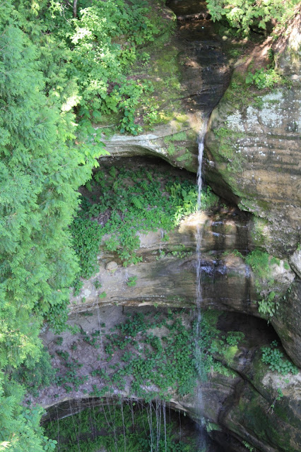 A waterfall tumbles like a thin, silvery veil at Starved Rock State Park.