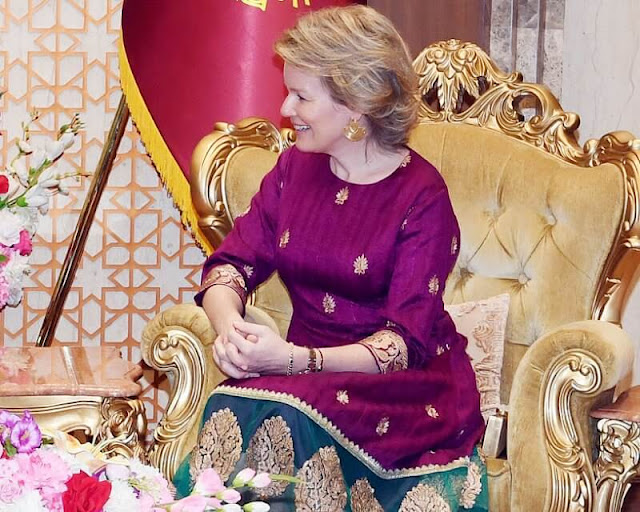 Queen Mathilde wore a floral print silk blouse, and an embroidered fuchsia pink midi dress. Prime Minister Sheikh Hasina