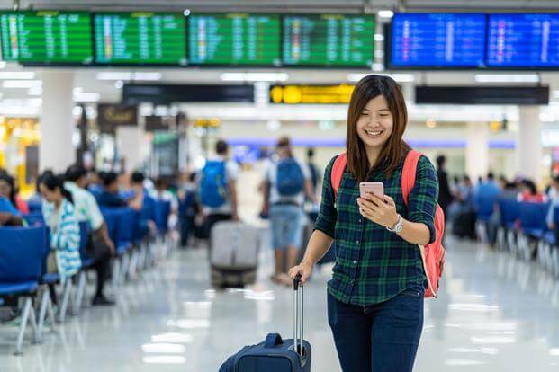 Student traveling for free at airport