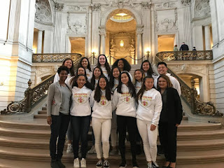 The Lincoln High varsity girls' volleyball team poses for a photo in the City Hall rotunda.