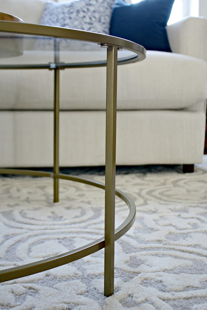Glass and metal round coffee table