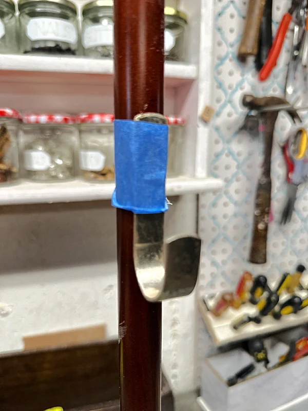 hook with painter's tape on pole