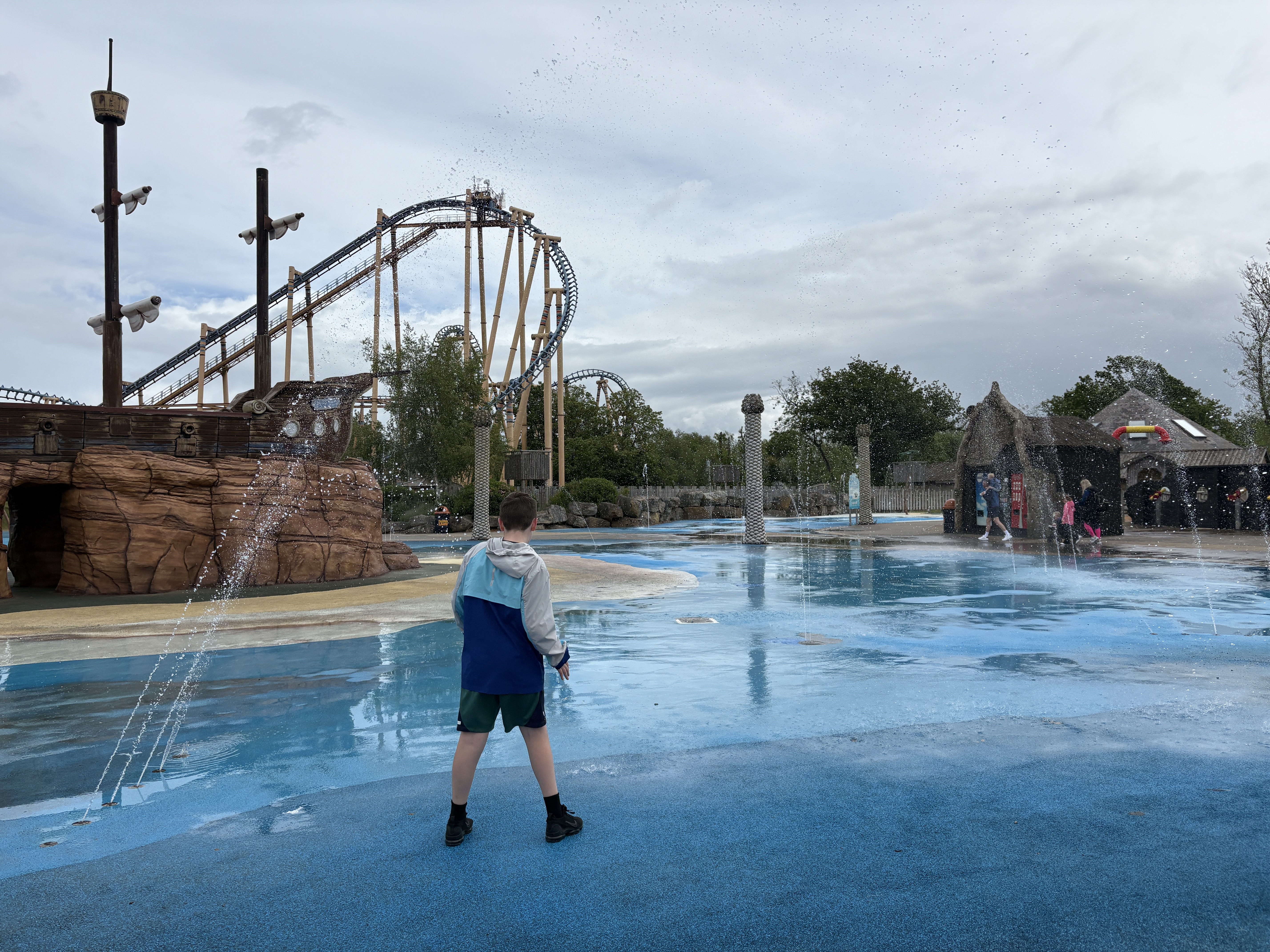 boy walking through the splash park at Flamingo Land zoo