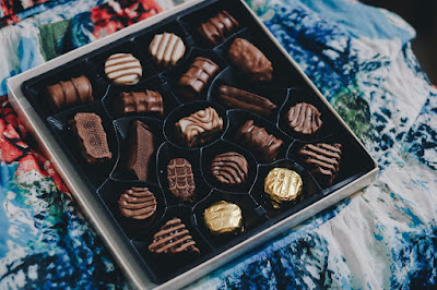 Box of chocolates on coloured cloth