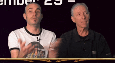 As Eric explains something, Keith suddenly gives him a faux-shocked look, which causes Eric to burst out laughing.