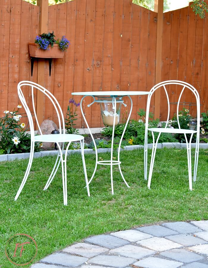 How to turn a hurricane candle holder into an inexpensive handmade DIY bistro table with upcycled second-hand bistro chairs to match.