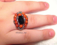 wire wrapped ethnic ring around finger