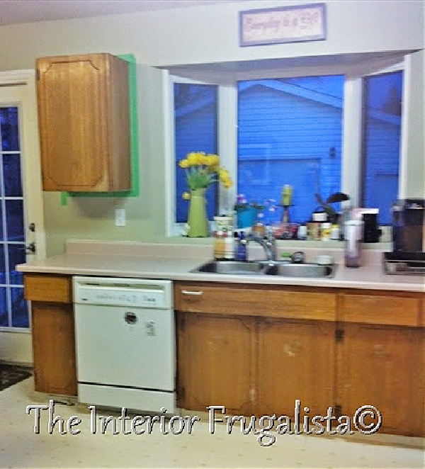 Tired and dated original kitchen cabinets before chalk paint makeover.