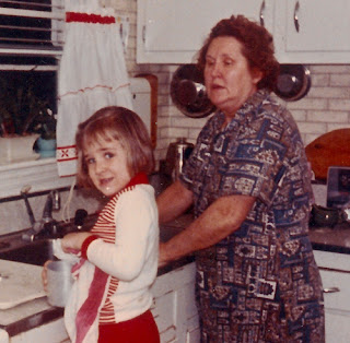 Sophie (Karvoius) Dixon and her granddaughter washing dishes, c. 1965.