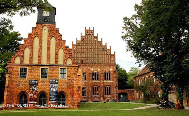 Two properties in red brick architecture.