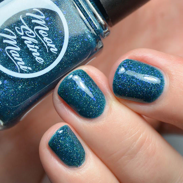 teal nail polish with holo and flakies