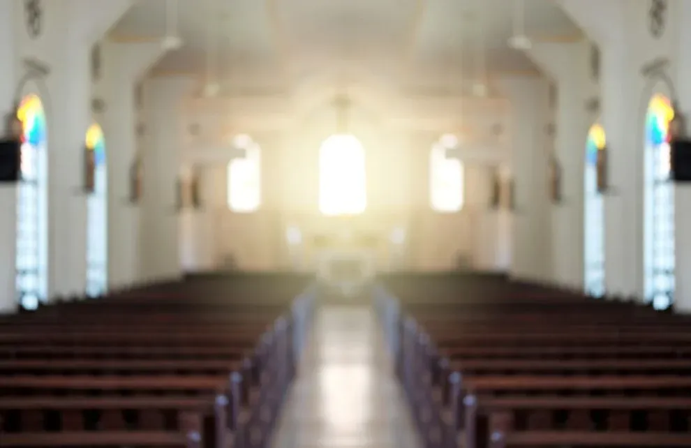 Blurred background of a surreal illuminated church aisle