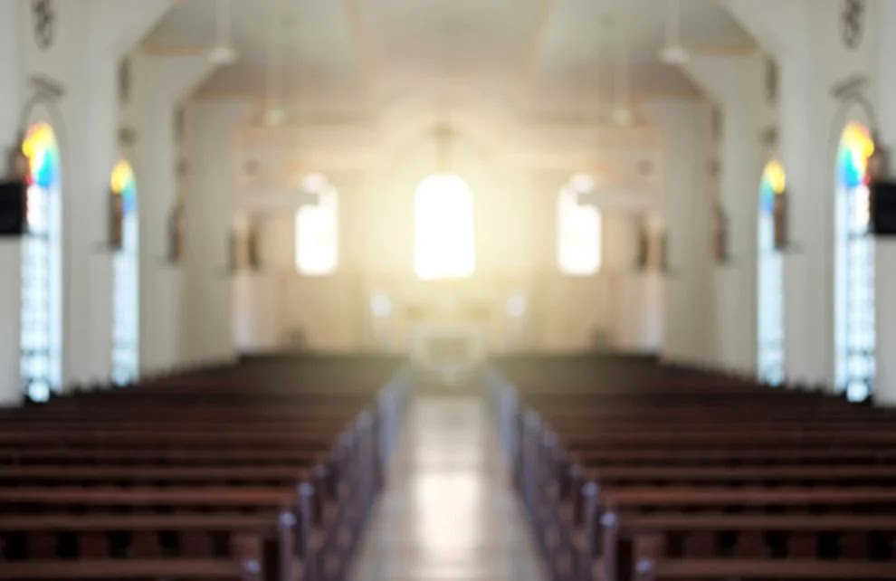 Blurred background of a surreal illuminated church aisle