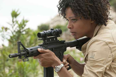 Naomie Harris as Eve aka Mrs. Moneypenny (taking a shot at Bond) in Skyfall (2012),  Directed by Sam Mendes