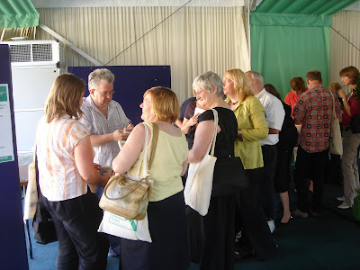 Ian McMillan signing his books at the Leeds Met Staff Development Festival, Innovation North Faculty Day