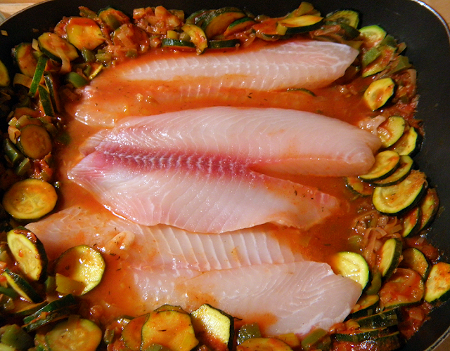 Fish Put into Pan, Waiting to be Covered with Veggies