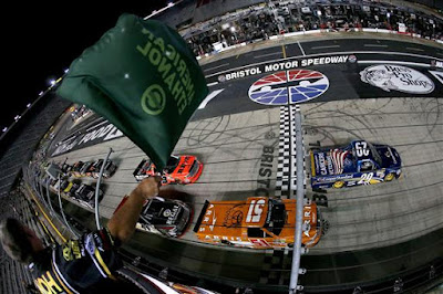 Tyler Reddick, driver of the #29 Cooper Standard Ford, leads the field  at the start of the NASCAR Camping World Truck Series UNOH 200