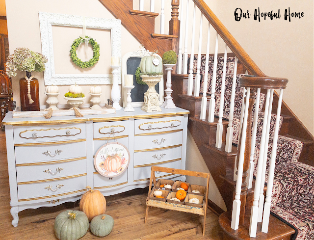 fall foyer decorated with pumpkins