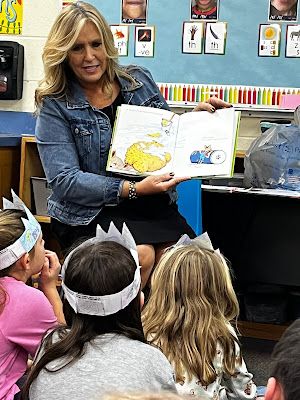 Susan Pittser, VMI Marketing Director reading to the 1st grade class during Read Across America