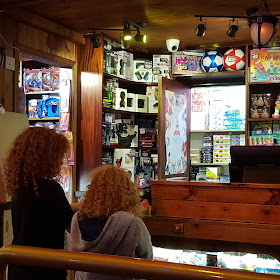 My two Children waiting at the prize counter to redeem tickets for goodies