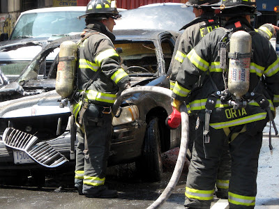 Firemen Fight Car Fire