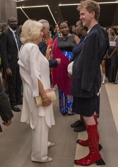 Duchess of Cornwall wore a royal blue lace gown, and a printed shirt dress. Jeannette Kagame, Carrie Johnson and Justin Trudeau