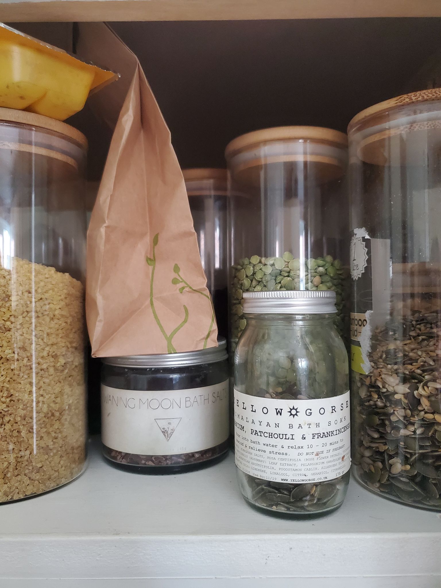 repurposed upcycled beauty product packaging used for pantry organization and reduce food waste
